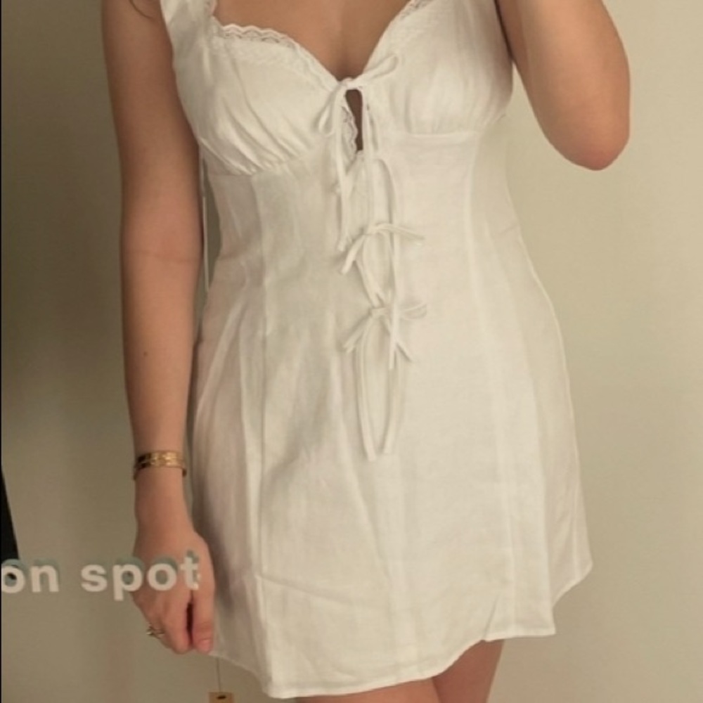Reformation white linen mini dress with bow details